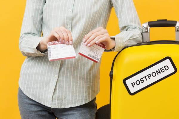 [600x400]front-view-woman-destroying-her-plane-ticket