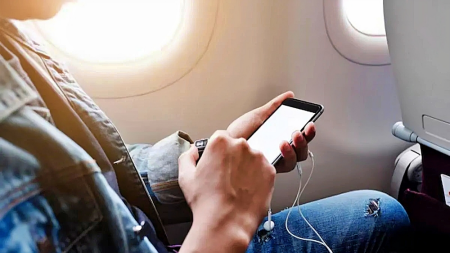 (enhanced_resize45)using-phone-on-airplane